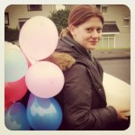 Corrie, having been laden with party balloons and cake by enthusiastic cake baker Grace (Copyright Corrie B)