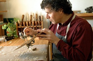 Sam Zygmuntowicz working on a violin