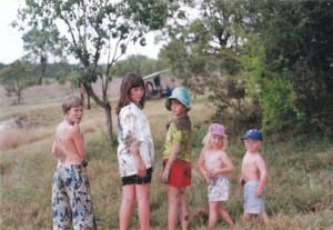 Childhood in Africa. I'm in the middle with the fetching red shorts.