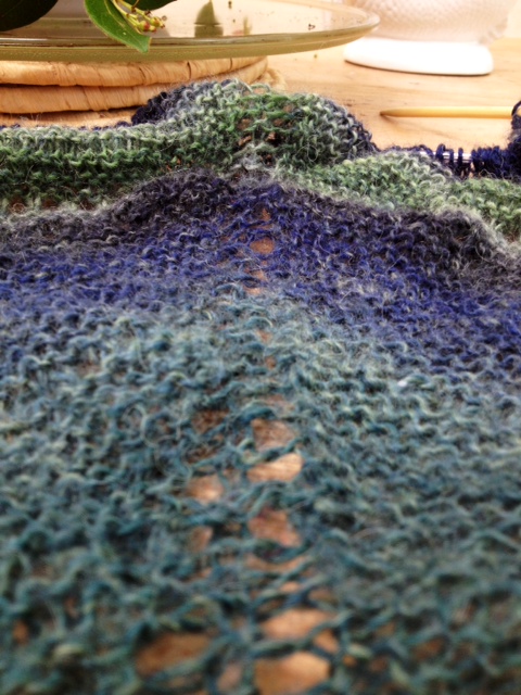 The central eyelet leading from point of shawl to knitted edge. The central eyelet leading from point of shawl to knitted edge.