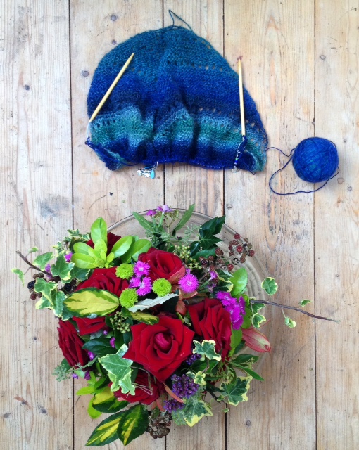 Birds Eye View with wedding roses and very blue-looking yarn. Birds Eye View with wedding roses and very blue-looking yarn.