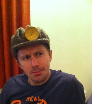 Miner's Hat on a miner. Miner's Hat on a miner.