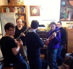 Playing assorted instruments in the music room.