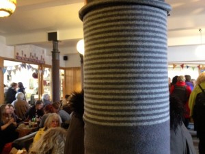 Yarn-bombed pillars.