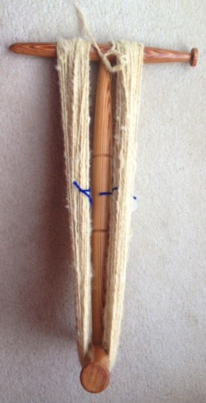 Two skeins on a niddy-noddy.