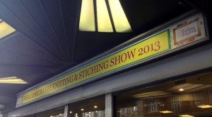 A rather angular photograph of "Welcome to the Knitting and Stitching Show 2013"