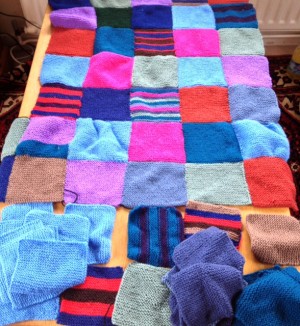 Aerial view of the Patchwork Blanket with squares to be completed at the bottom.