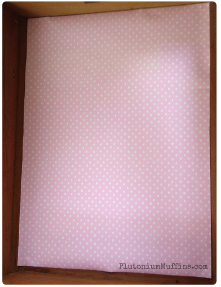 Pink dotty lining paper.