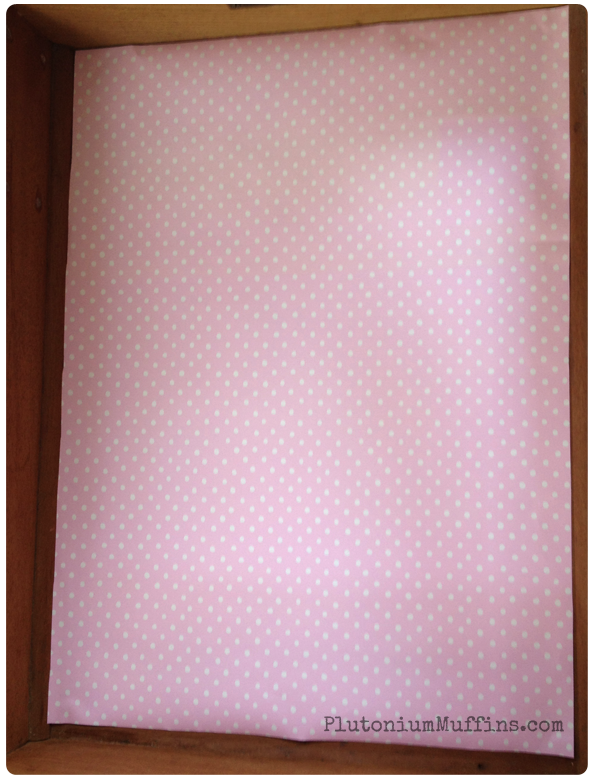 Pink dotty lining paper.