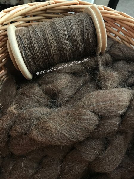 A basket full of alpaca fibre to turn into a jumper.