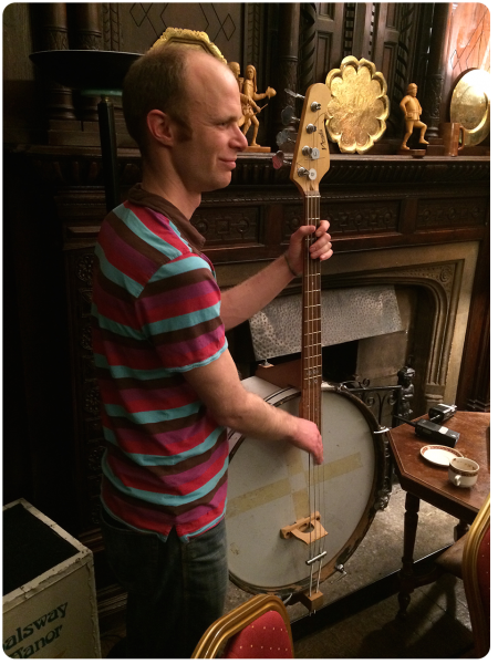 Tutor Matt playing the bass banjo during an impromptu session in the Halsway Manor bar.