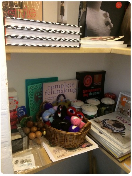 A corner of lovely books and crochet eyes for hats.