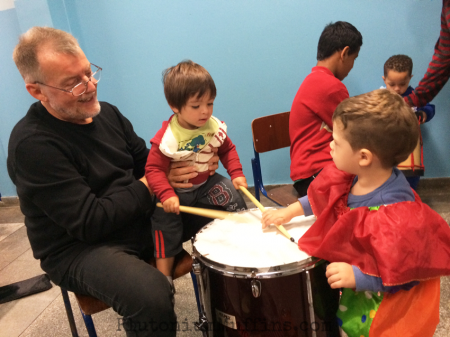 Teaching children how to drum.