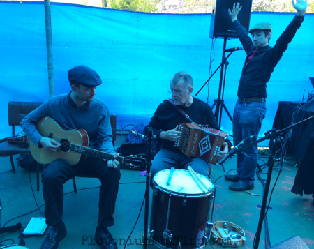 Bandmates playing and JS stretching at the churrasco.