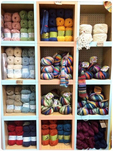 Brightly coloured yarn piles.