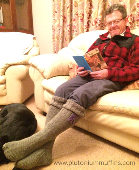 Dad enjoying his ridiculous welly socks with his faithful friend, Jet, at his feet.