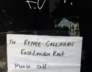 The sign on the front door of the building housing the East London Knit studio.