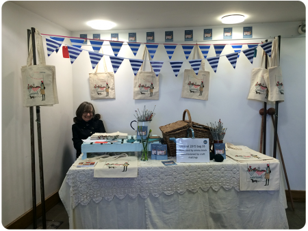 A cheerful booth in the foyer of the Farnham Maltings building.