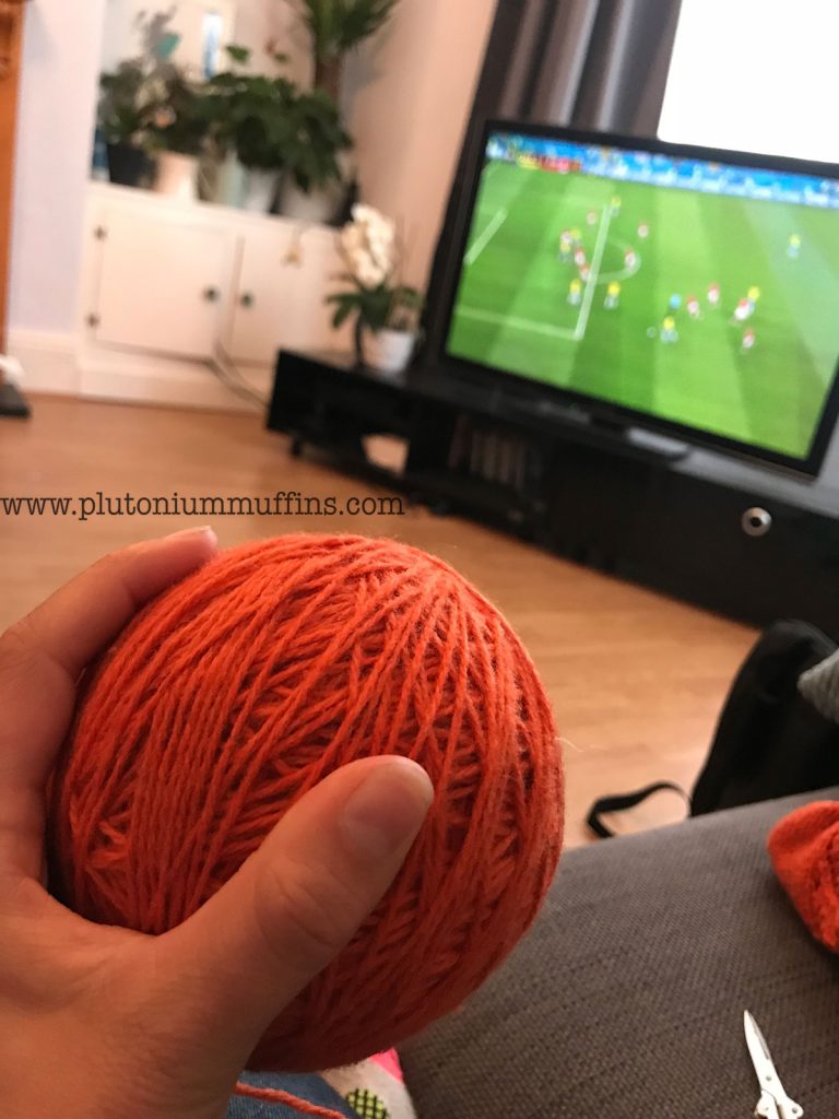 Watching football with knitting, a pleasant past time!