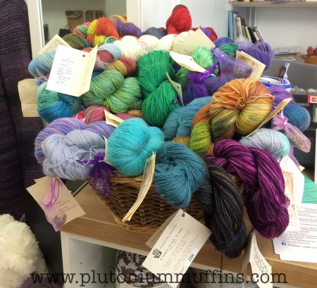 A basket filled to the brim with luxurious yarn.