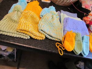 An assortment of hats and mitts by the wonderfully generous bigbadbrenda. Image copyright bigbadbrenda 2014.