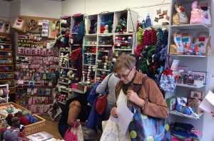 The inside of the shop with the big shelves of yarn.