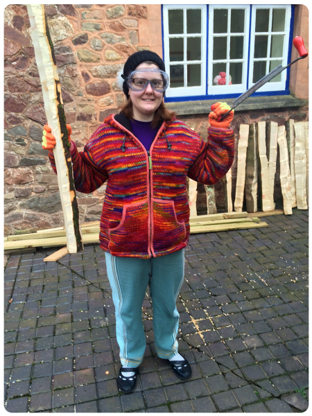 Me with my slightly less de-barked log and a draw knife.