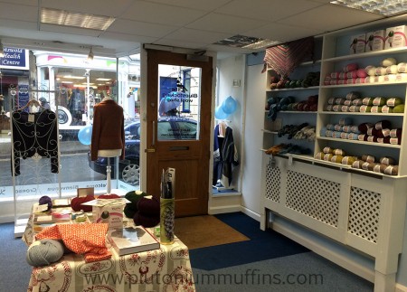 View of the interior of the Bluestocking Wool Shop. Looking towards the door of the shop from the till.