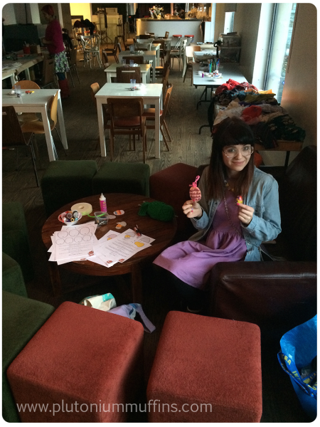 Louise ready to go with a Creme Egg and her table of fabrics behind her!