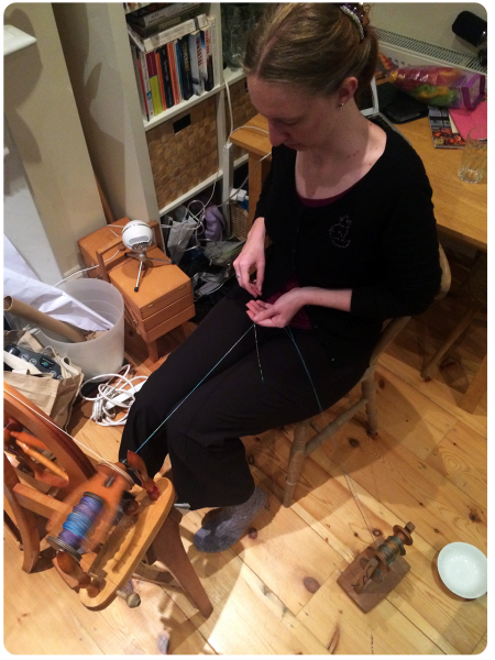 Melanie plying the rainbow yarn.