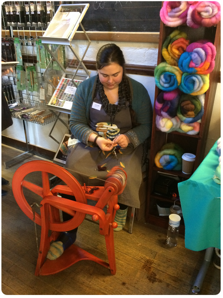 Heather spinning, with her gorgeous batts behind her.