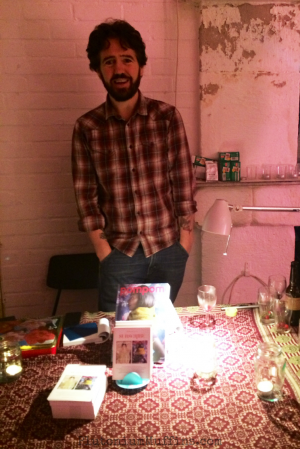 A handsome chap selling copies of the magazine.