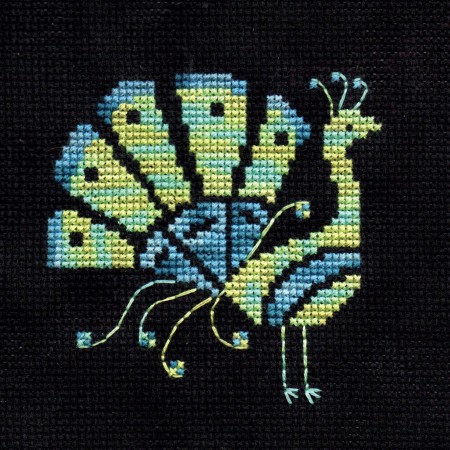 A cross stitch peacock by Durene Jones