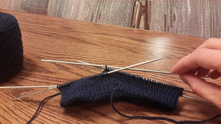 Pixieish Blonde is also knitting a hat, and about to get into the ribbing.