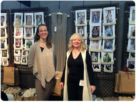 The beautiful Purl Alpaca ladies, with the Icon Dress that inspired me behind them. The Knitting and Stitching Show, March 2015.