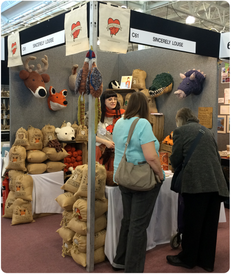 Sincerely Louise at the Spring Knitting and Stitching Show, chatting to customers.