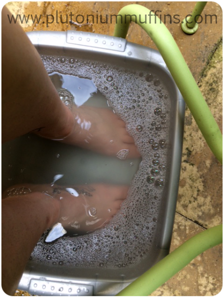 I just use a washing up basin which I bought in a pound shop about five years ago. I only use it for this purpose as I don't want my feet to soak in harsh chemicals, and don't want washing up to be done in foot water! I used to use a bath filled to foot-level with the relevant temp. water, but it cools much quicker and is much less comfortable.