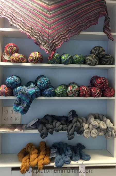 Sock yarns on sale in the BWS, including Coop Knits and Opal. Sock yarns as you walk into the Bluestocking Wool Shop.