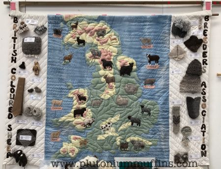 A quilted map of the UK showing all the coloured sheep in their locations.