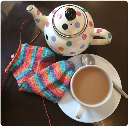 Working on my Angel socks with a matching teapot in Edinburgh!