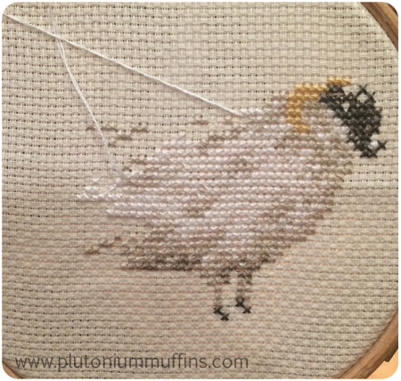 My cross-stitch sheep in much greater glory.